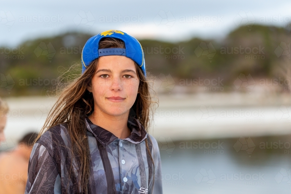 Image Of Tween With Tousled Brown Hair Wearing Baseball Cap