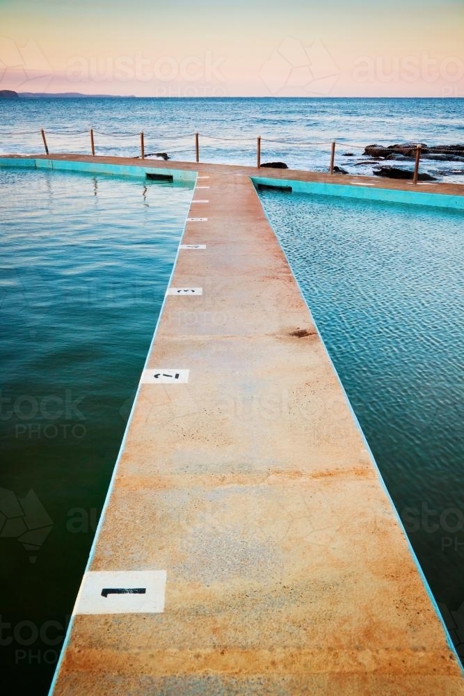 Twilight settles over coastal swimming baths at Collaroy - Australian Stock Image