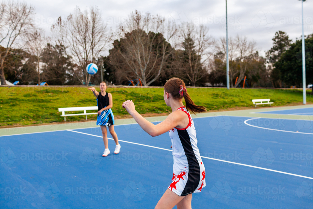 Two Aboriginal sports players training for netball game at the court at Rose Point Singleton - Australian Stock Image