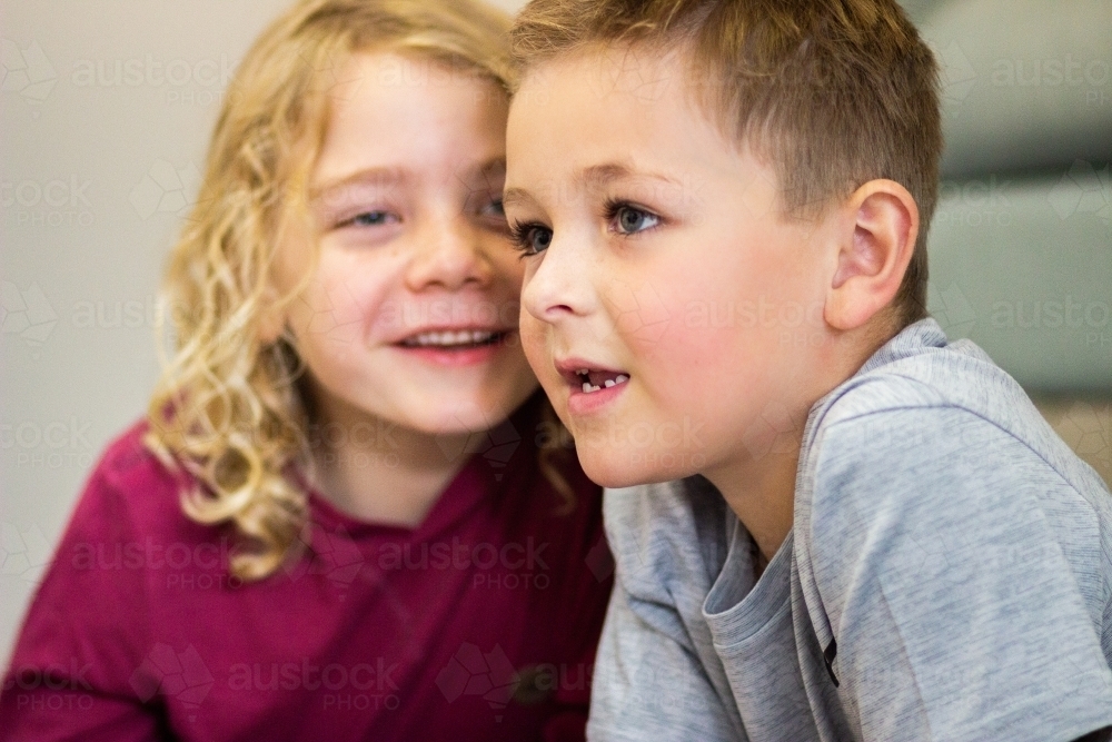 Two boys whispering together - Australian Stock Image