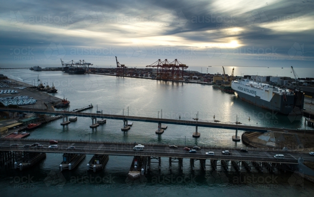 Two bridges linking a port over a body of water. - Australian Stock Image