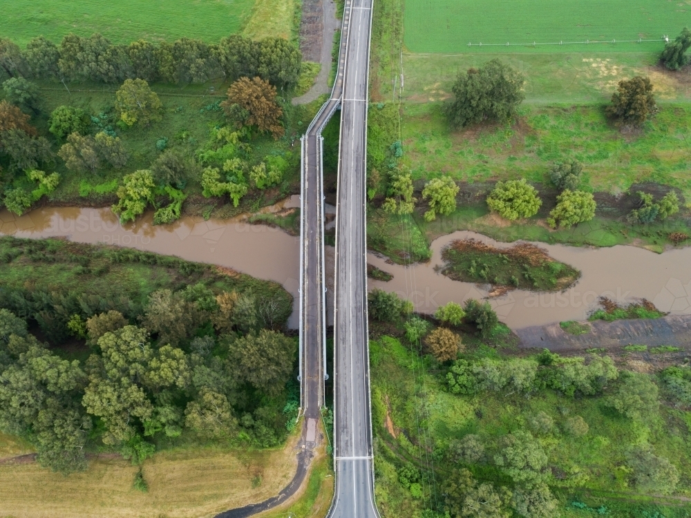 Two bridges over muddy hunter river, car bridge and foot bridge - Australian Stock Image