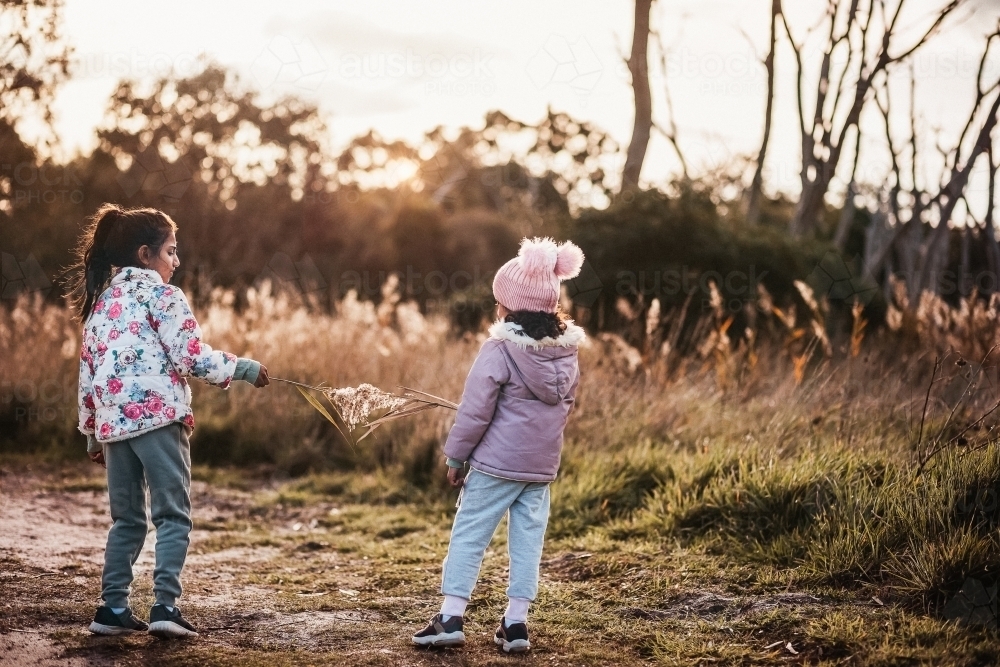 two children playing outdoors - Australian Stock Image