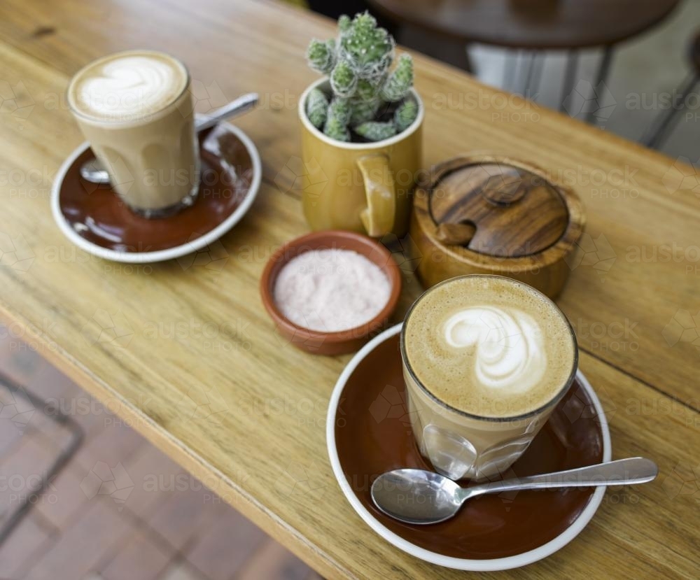Two coffees on a table in a cafe. - Australian Stock Image