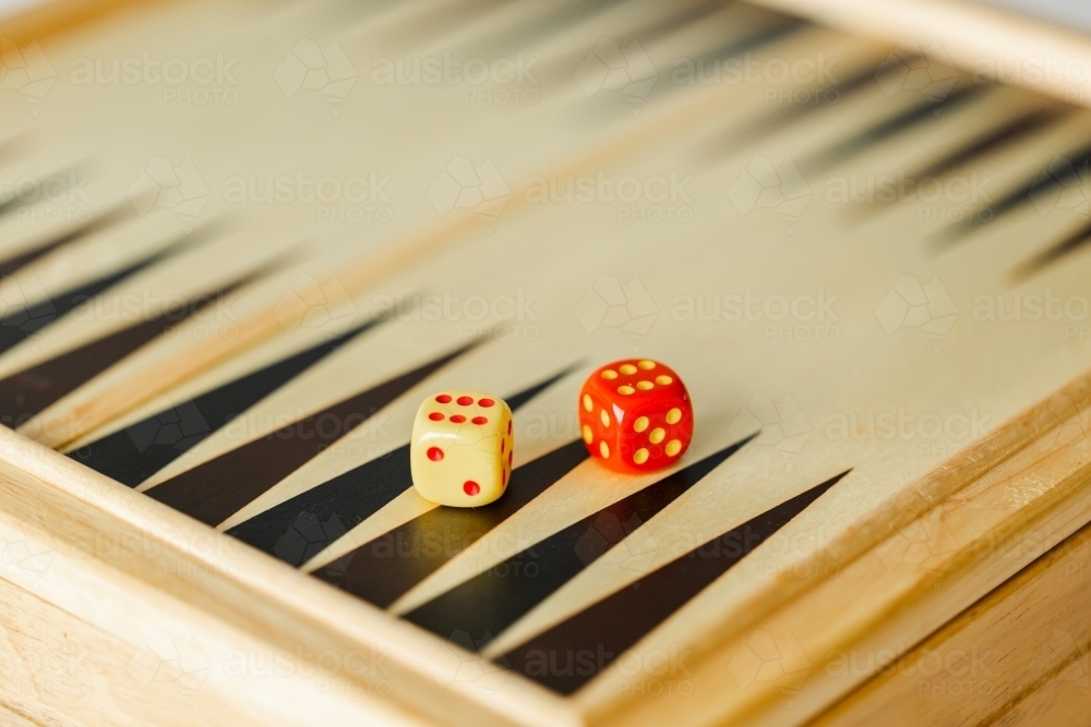 Two coloured dice for indoor board game - Australian Stock Image