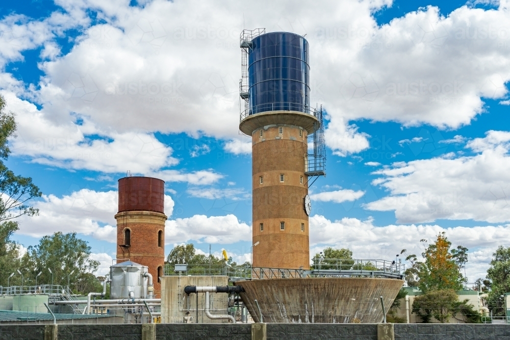 Two concrete water towers with tanks on top at a treatment plant - Australian Stock Image