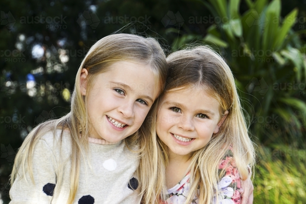 Two cute sisters headshot - Australian Stock Image