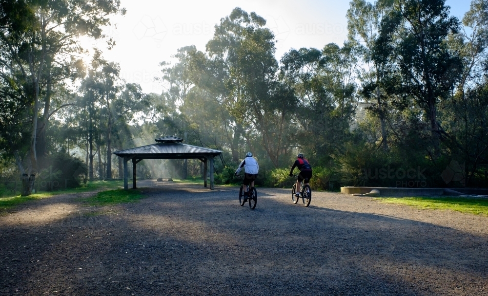 Two Cyclists on a Bike Trail in Warrandyte - Australian Stock Image