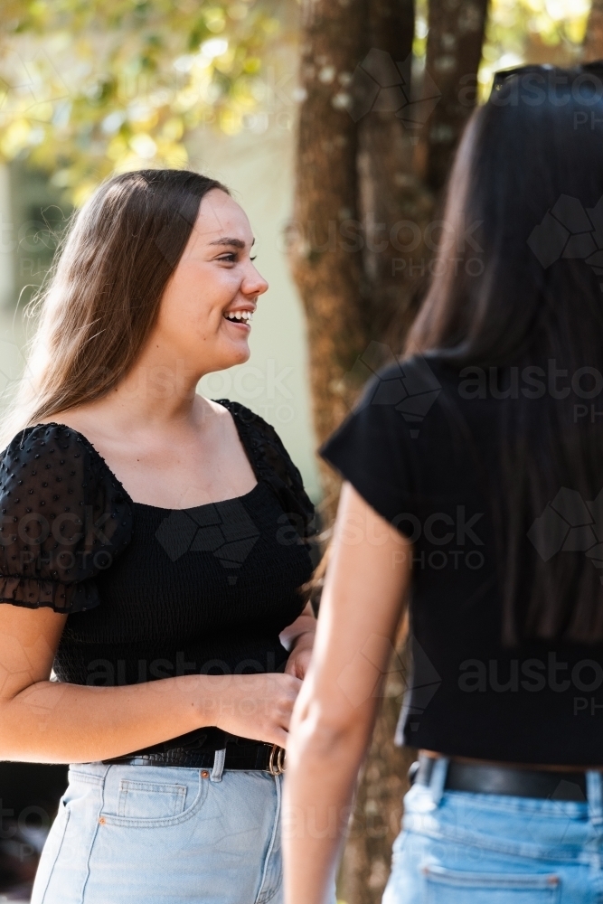 two friends chatting - Australian Stock Image