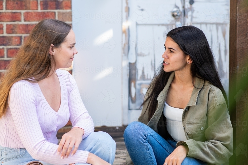 two friends chatting - Australian Stock Image