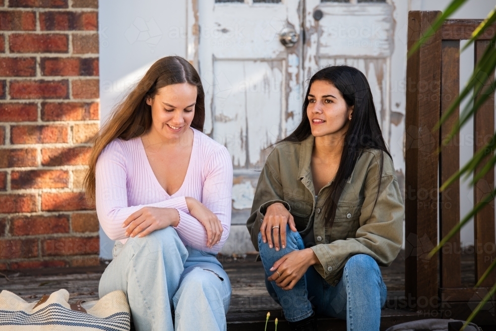 two friends chatting - Australian Stock Image