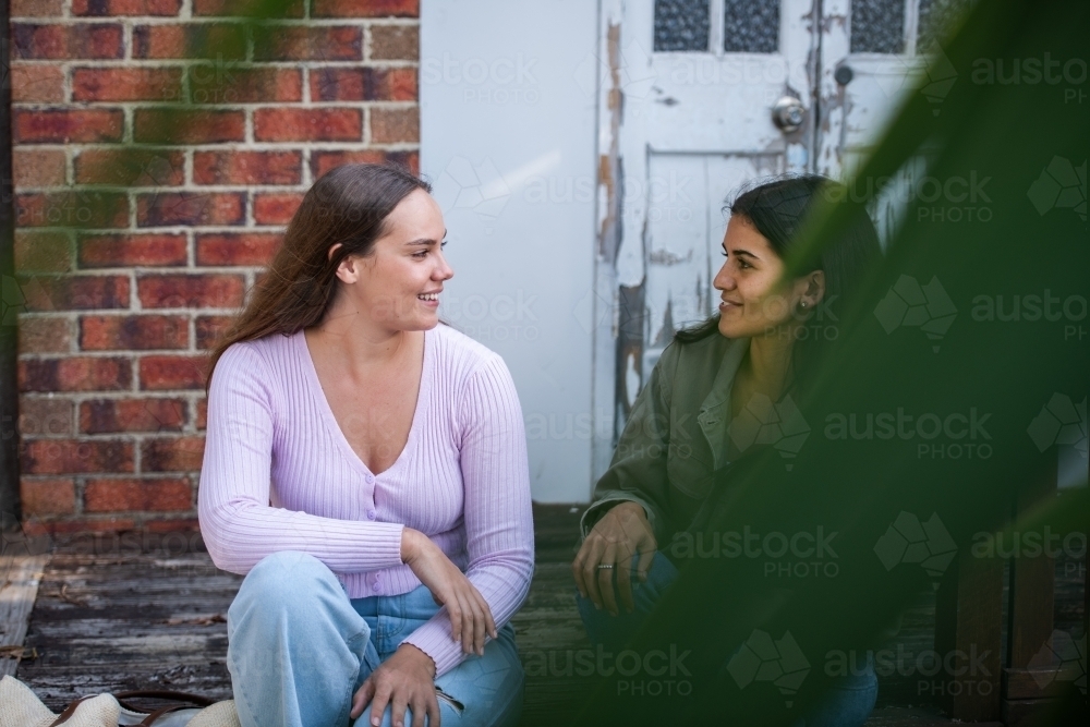 two friends chatting - Australian Stock Image