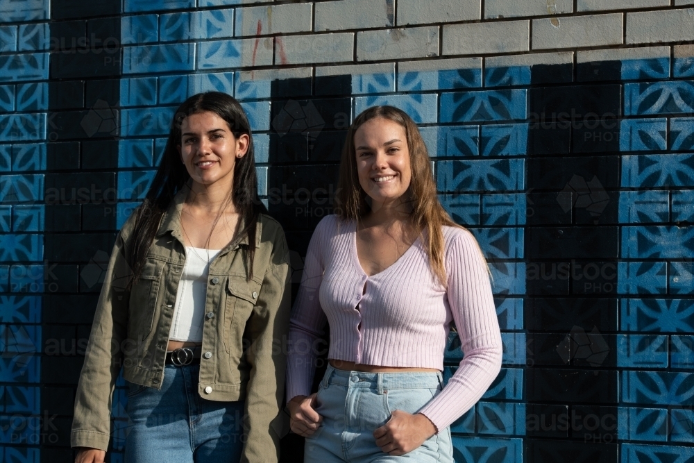 two friends hanging out in an urban setting - Australian Stock Image