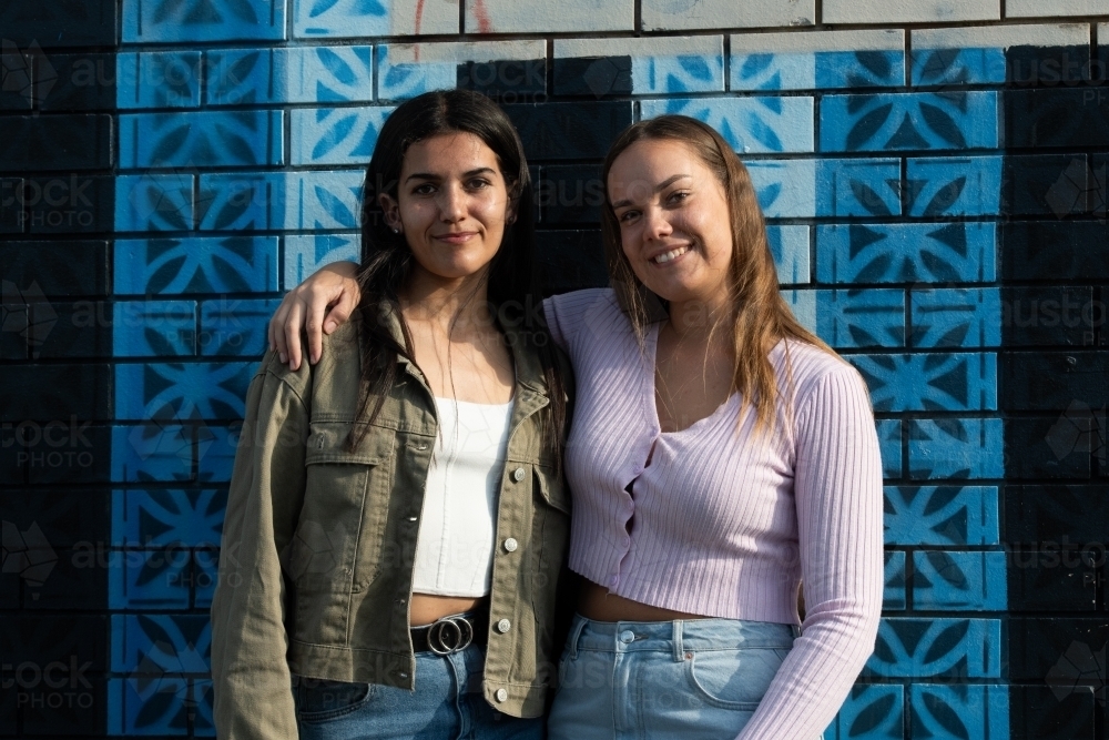 two friends hanging out in an urban setting - Australian Stock Image
