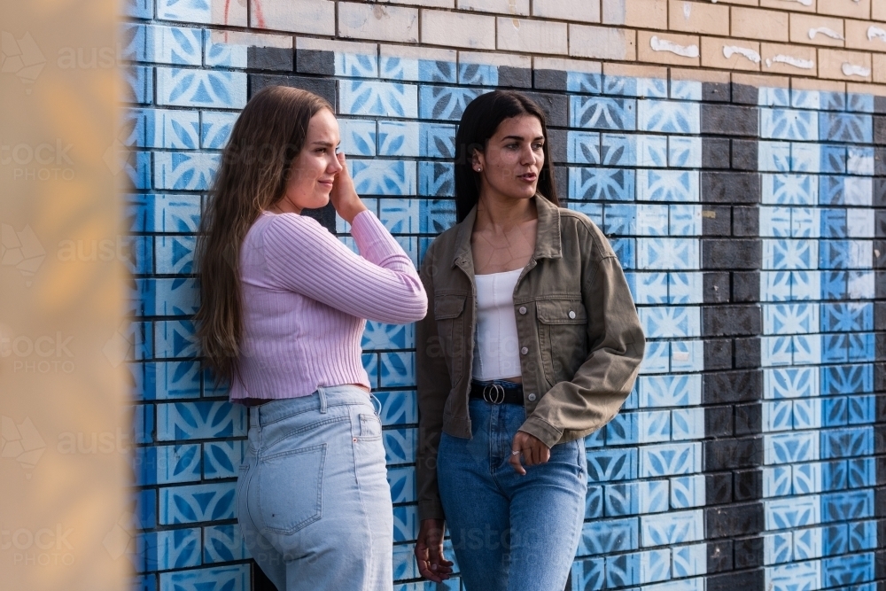 two friends hanging out in an urban setting - Australian Stock Image