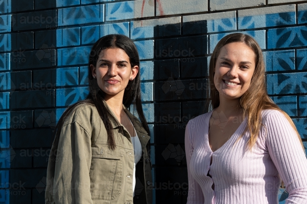 two friends hanging out in an urban setting - Australian Stock Image