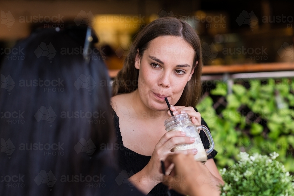 two friends in a cafe - Australian Stock Image