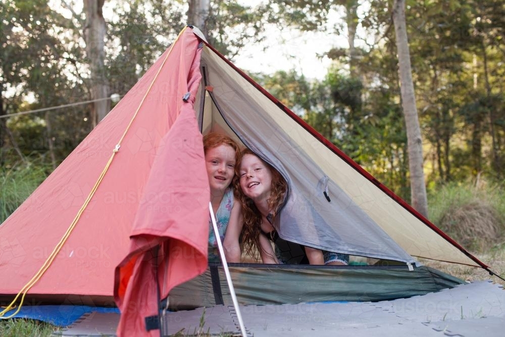 Two girls in an orange tent - Australian Stock Image