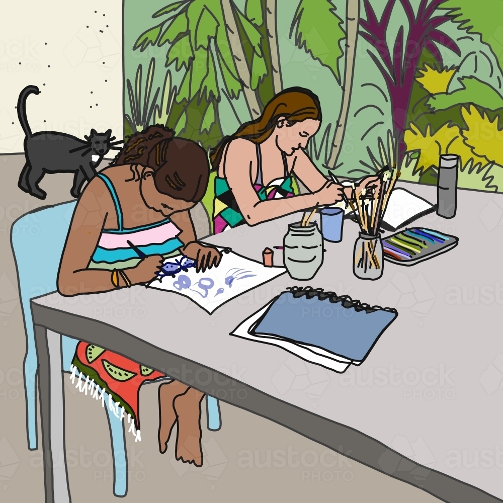 Two girls in bathers and towels painting at outdoor table at home with cat in background - Australian Stock Image