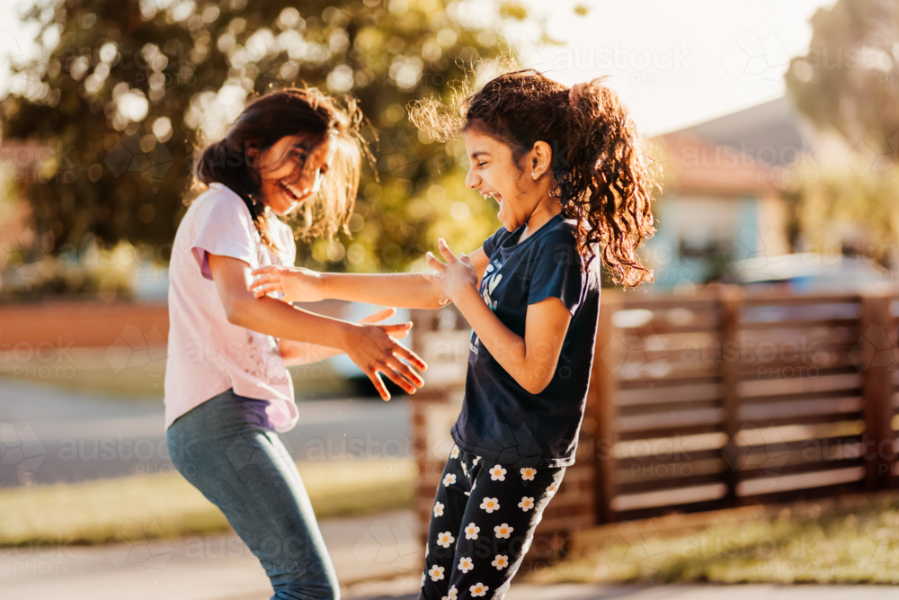 two girls playing in the neighbourhood - Australian Stock Image