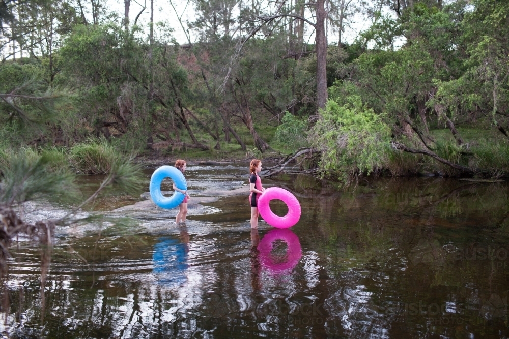 Two girls ready to swim in the river - Australian Stock Image