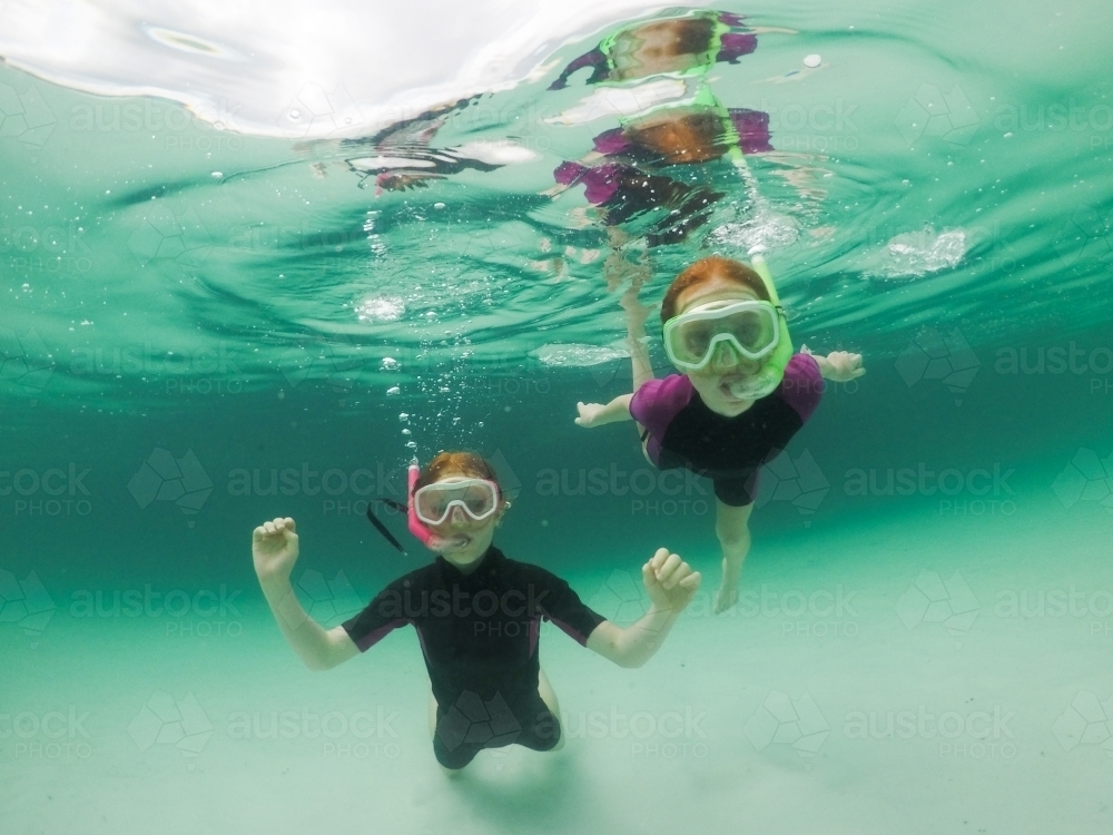 Two girls snorkelling - Australian Stock Image