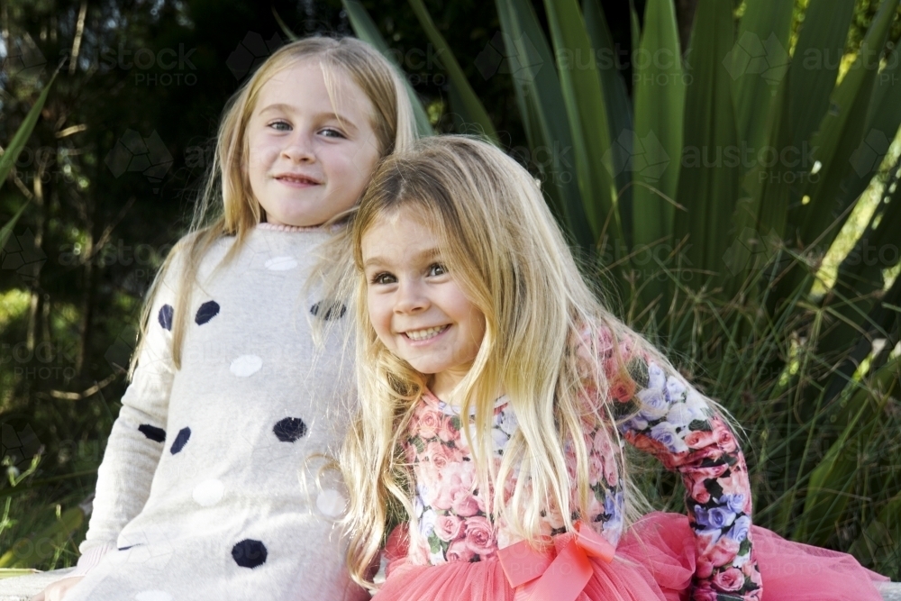 Two girls under 10 playing to camera - Australian Stock Image