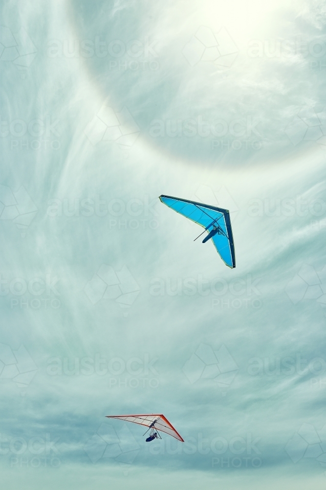 two gliders flying with a sun halo on a summer's day - Australian Stock Image