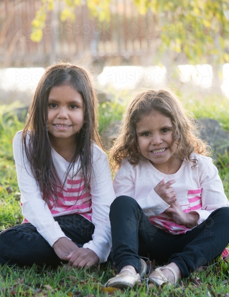 Two happy Aboriginal girl sisters - Australian Stock Image