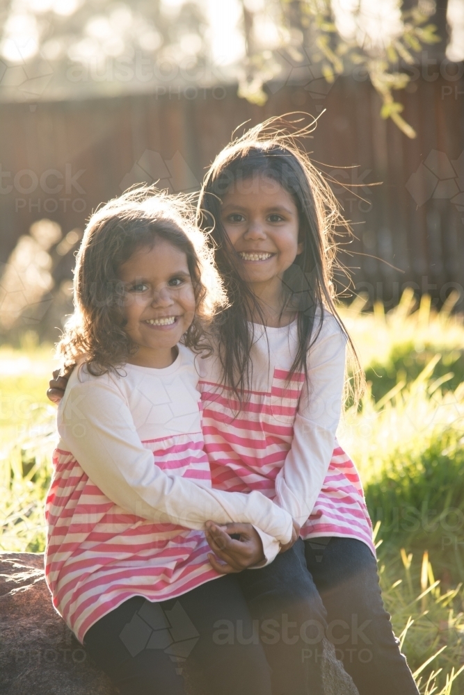 Two happy Aboriginal girl sisters - Australian Stock Image