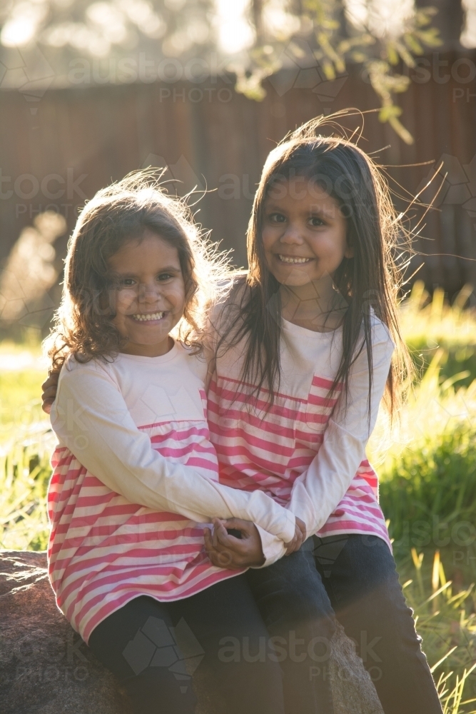 Two happy Aboriginal girl sisters - Australian Stock Image