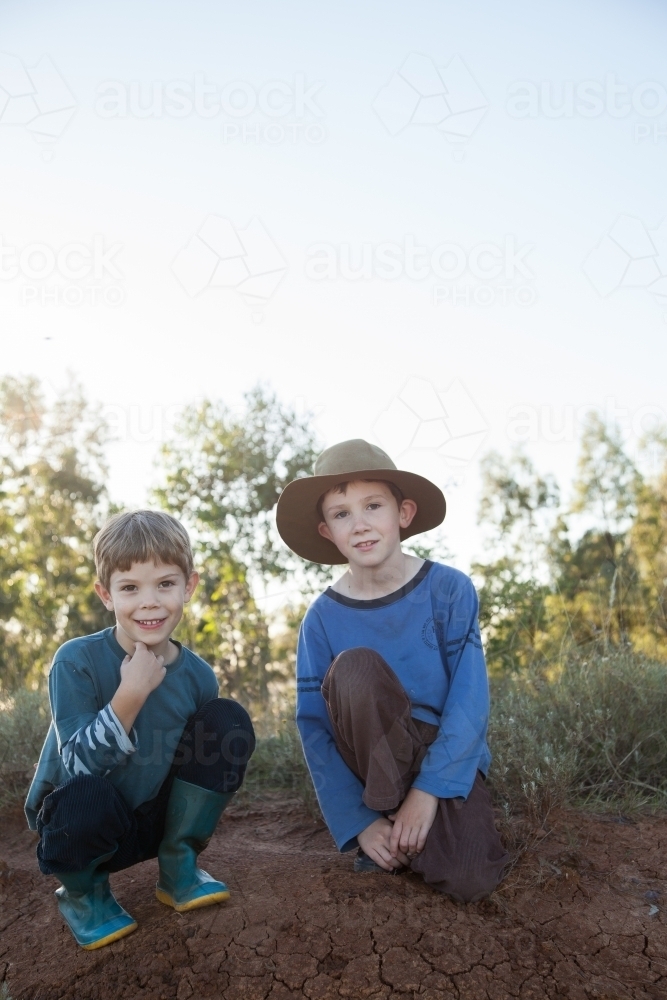 Two happy Aussie kids looking at camera with copy space - Australian Stock Image