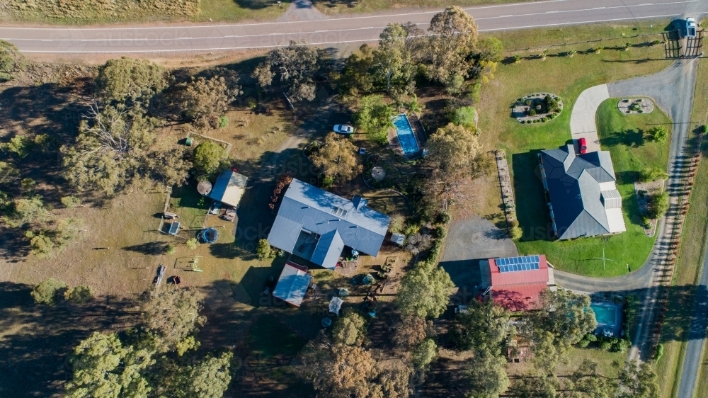 Image Of Two Houses On The Outskirts Of A Town One Neat And Tidy The Other Messy And A Paddock Austockphoto