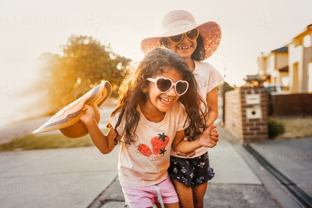 two little girls laughing - Australian Stock Image
