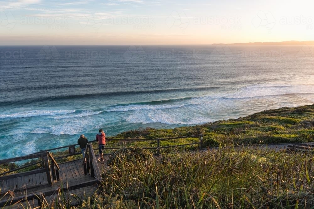 Two people looking out to see from a scenic viewpoint - Australian Stock Image