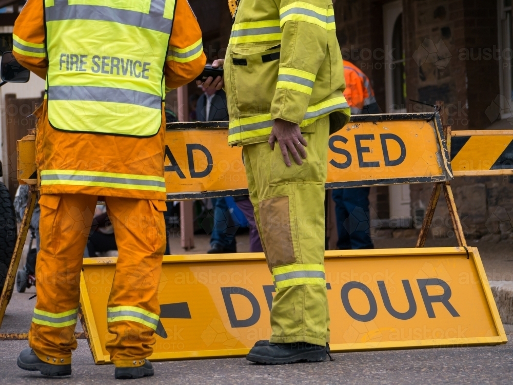 Two rural fire service men manning a detour sign - Australian Stock Image