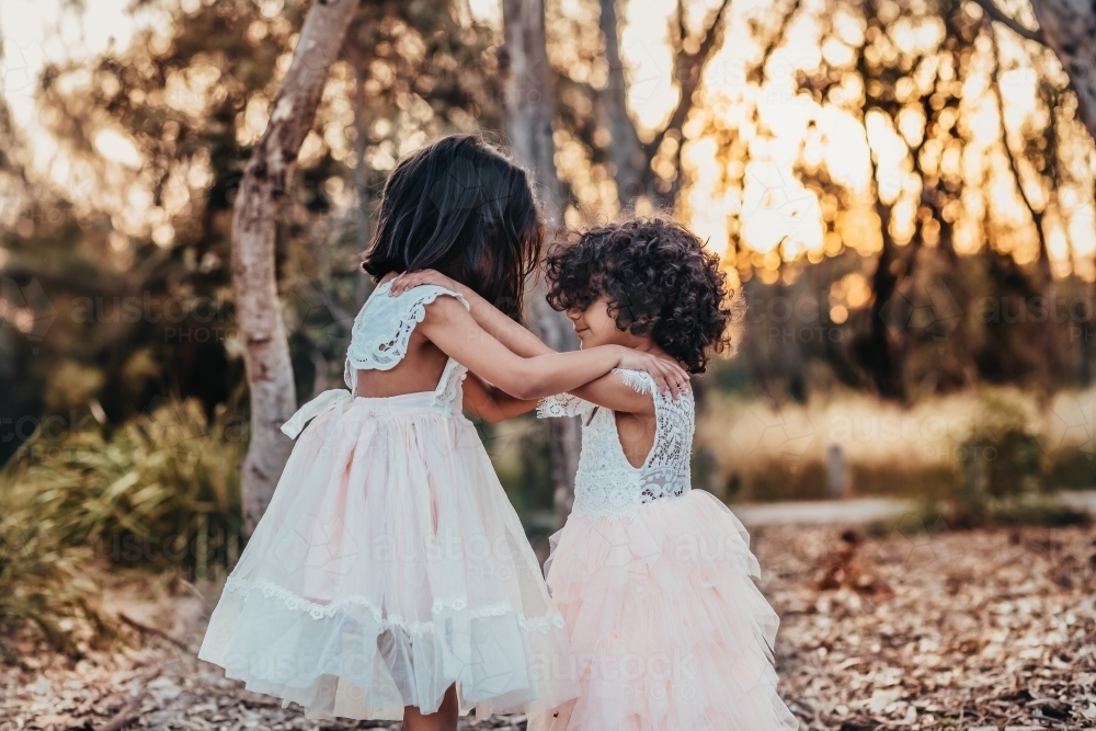 Two sisters looking at each other - Australian Stock Image