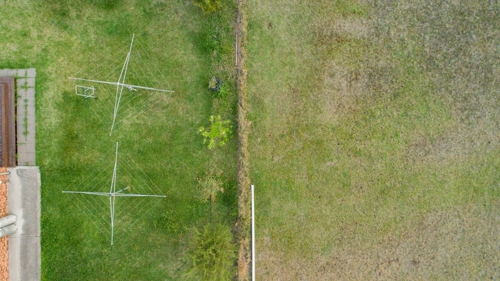 Two washing lines in backyard top down aerial shot - Australian Stock Image