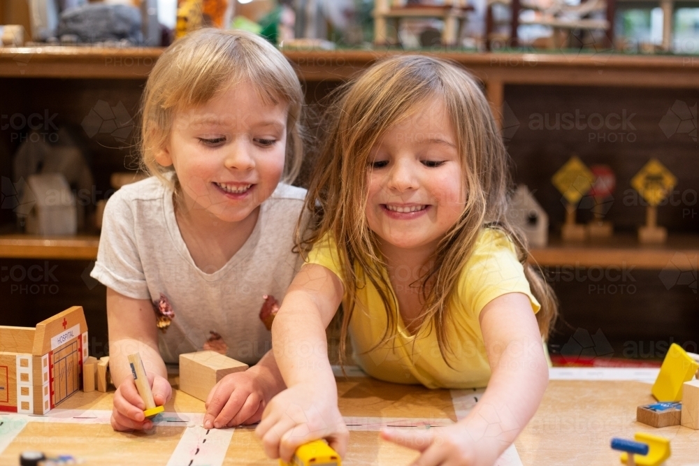 Two young girl friends playing - Australian Stock Image