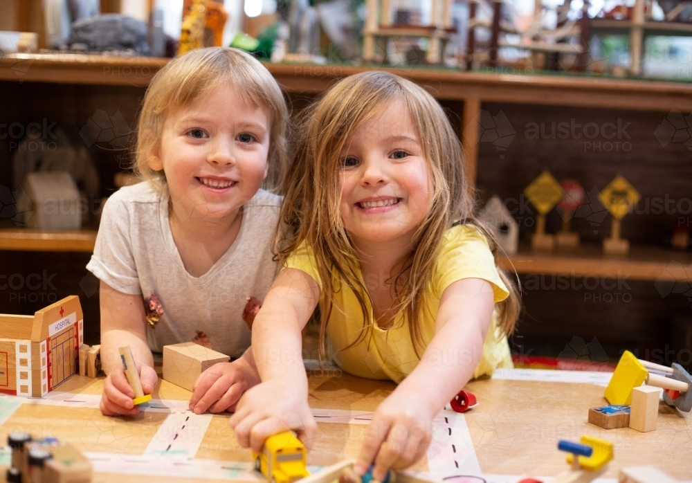 Two young girl friends playing - Australian Stock Image