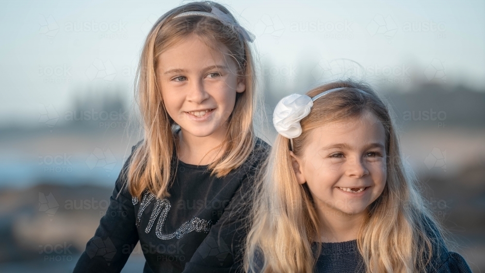 Two young girls close up at the beach - Australian Stock Image