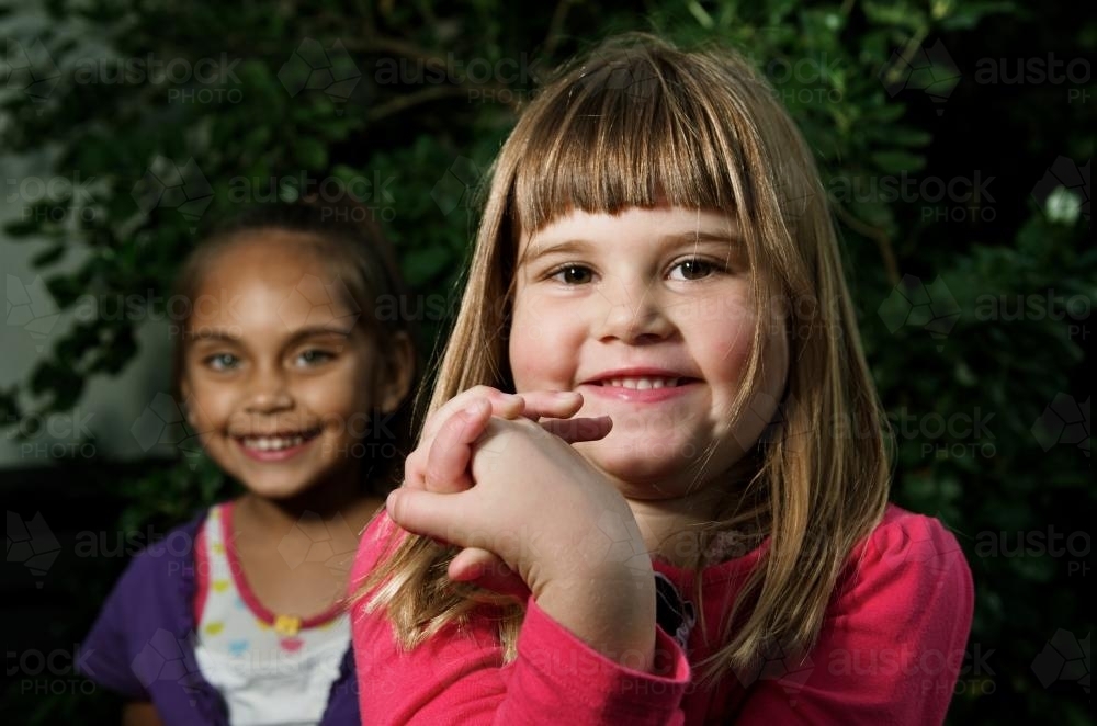 Two Young Smiling Girls - Australian Stock Image