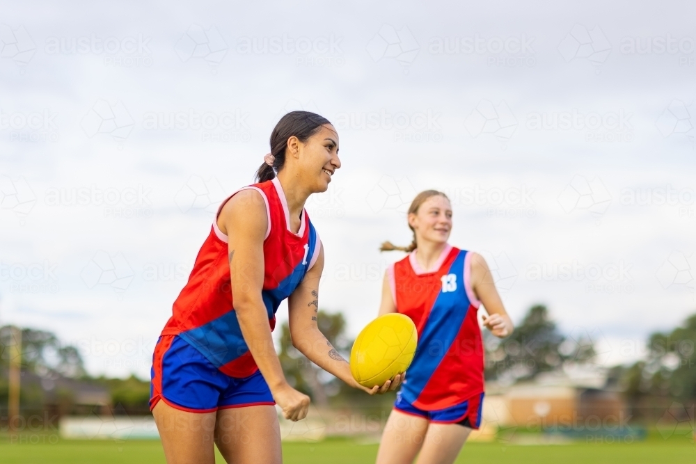 two young women on the field at football training - Australian Stock Image