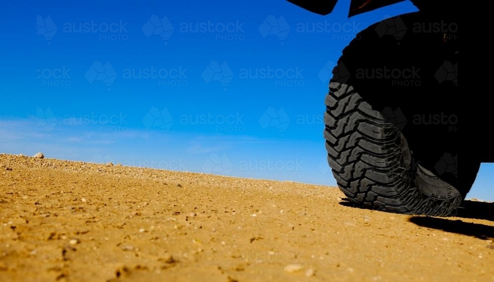 tyre in the desert - Australian Stock Image