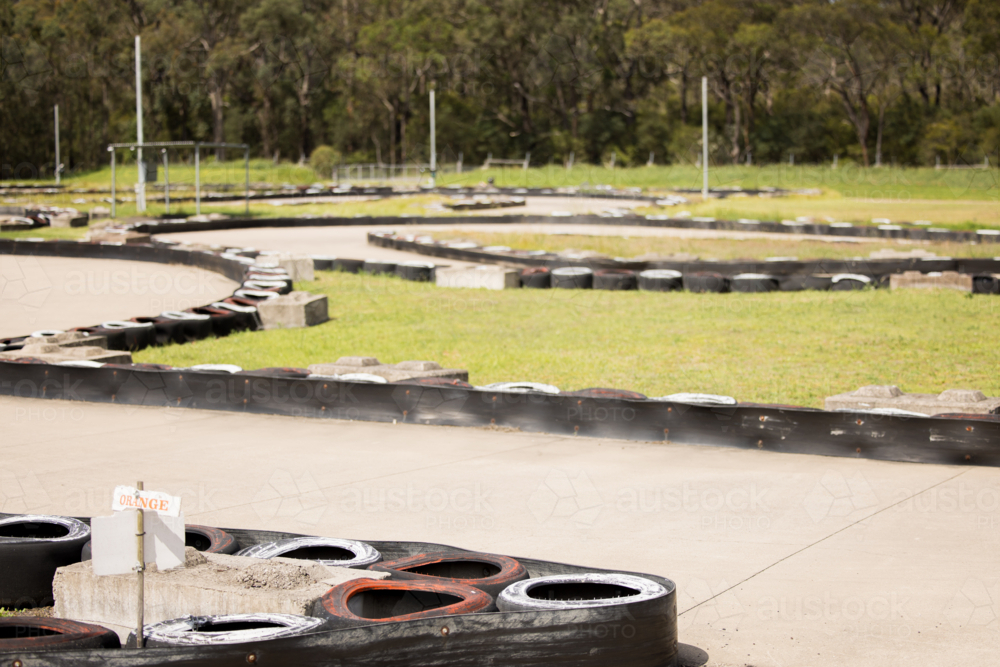 Tyre safety barrier around outdoor go kart track - Australian Stock Image