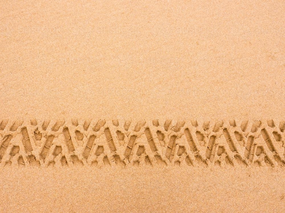 Tyre tread pattern in beach sand - Australian Stock Image