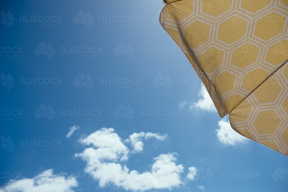 Under the beach umbrella - Australian Stock Image