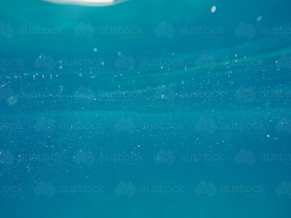 Underwater clear blue ocean bubbles - Australian Stock Image