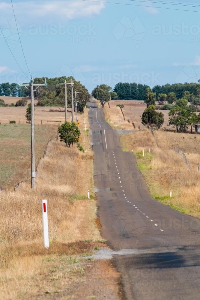 Image of Undulating country road - Austockphoto