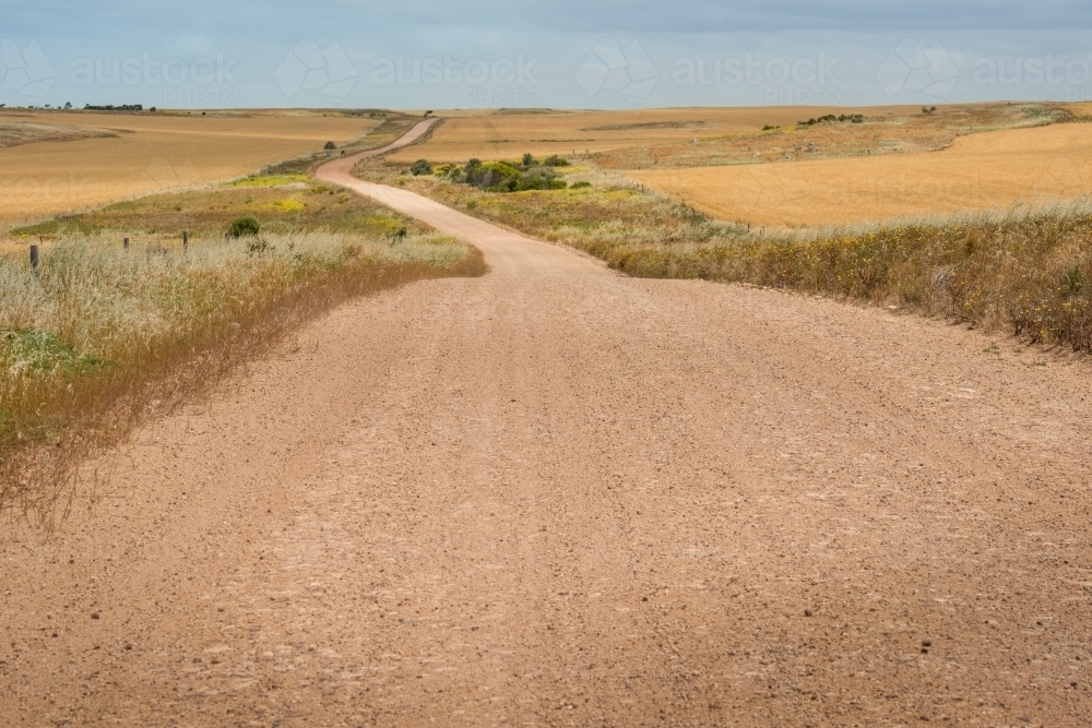 Unsealed road through regional area - Australian Stock Image